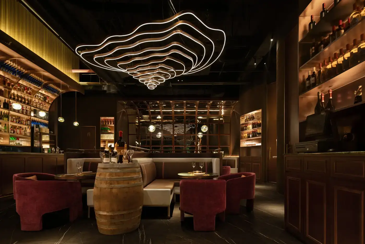 A modern restaurant dining room with warm ambient lighting